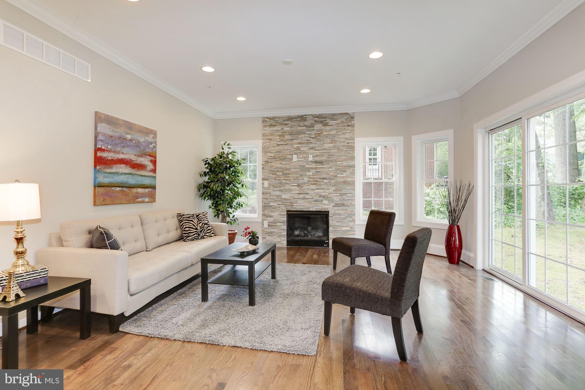507 South Rolling Road Baltimore, MD 21228 - Photo 14 of 30 a living room with furniture and a fireplace