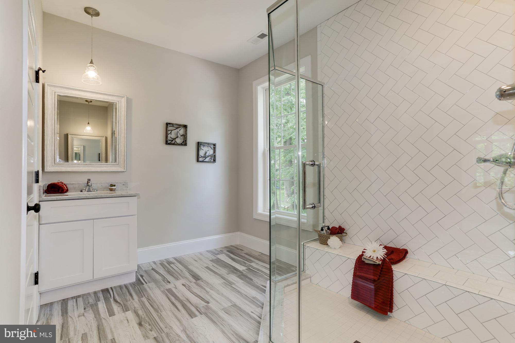 507 South Rolling Road Baltimore, MD 21228 - Photo 21 of 30 a bathroom with a sink and a mirror