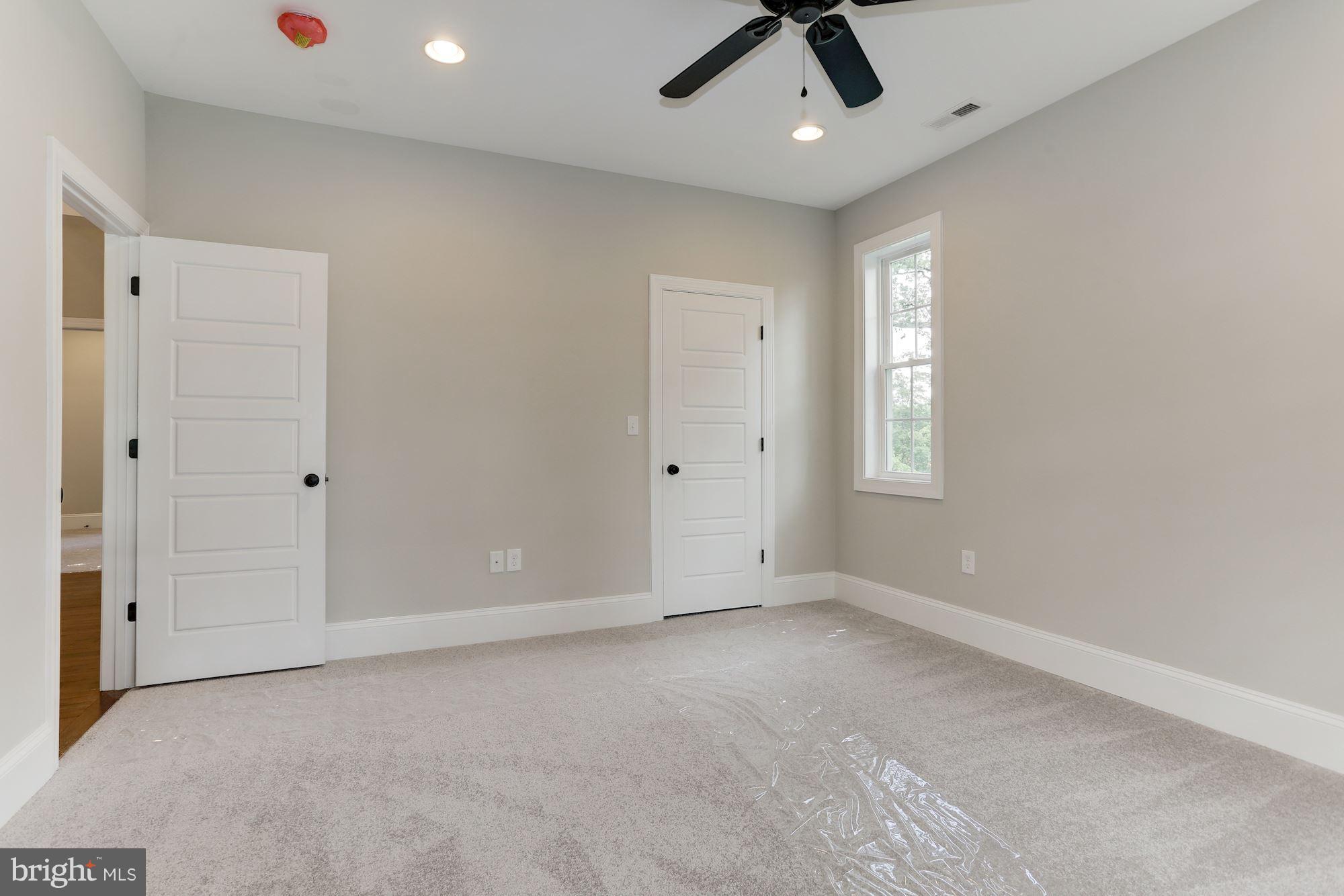 507 South Rolling Road Baltimore, MD 21228 - Photo 24 of 30 an empty room with a window and a ceiling fan