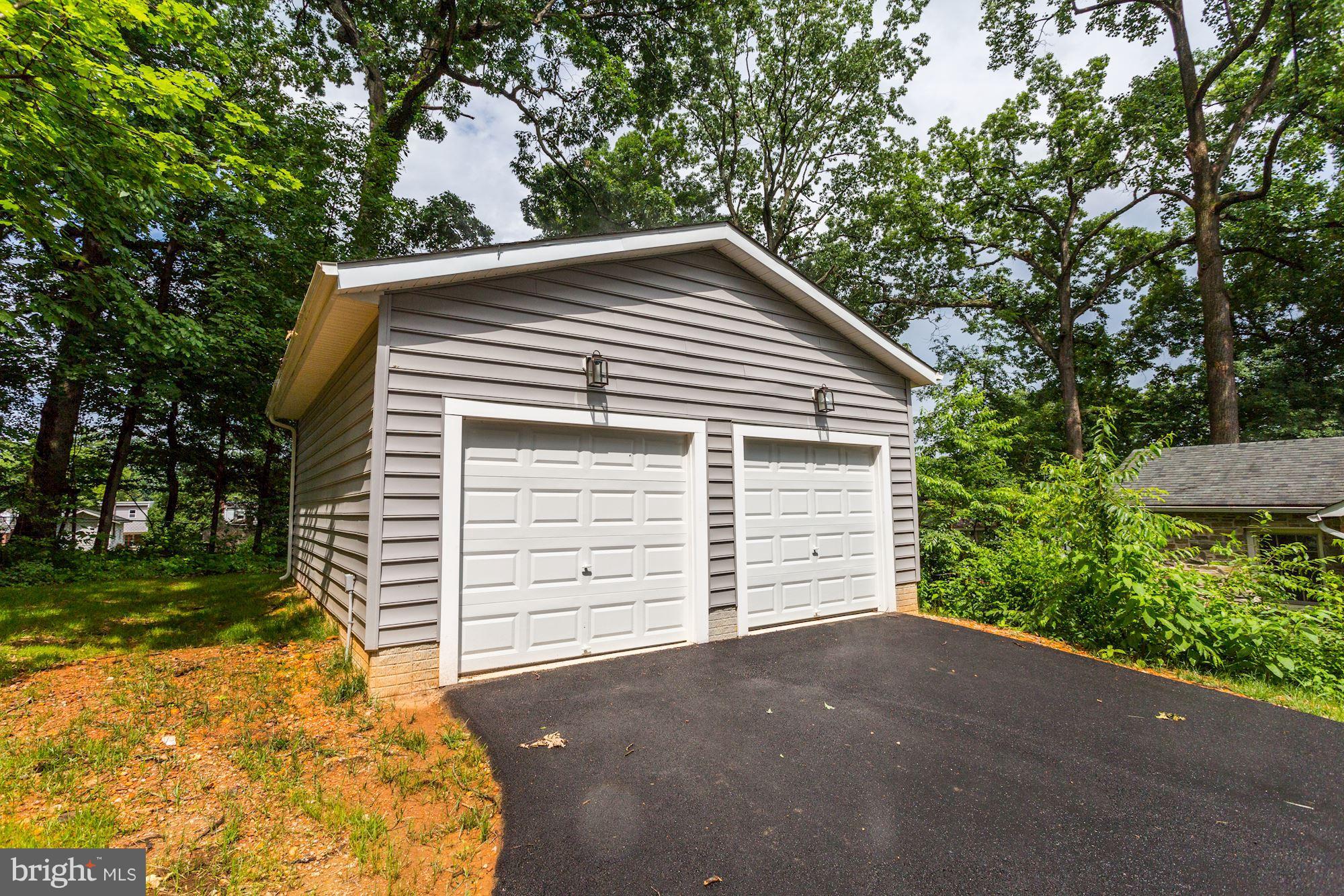 507 South Rolling Road Baltimore, MD 21228 - Photo 28 of 30 a view of a house with a backyard and garage