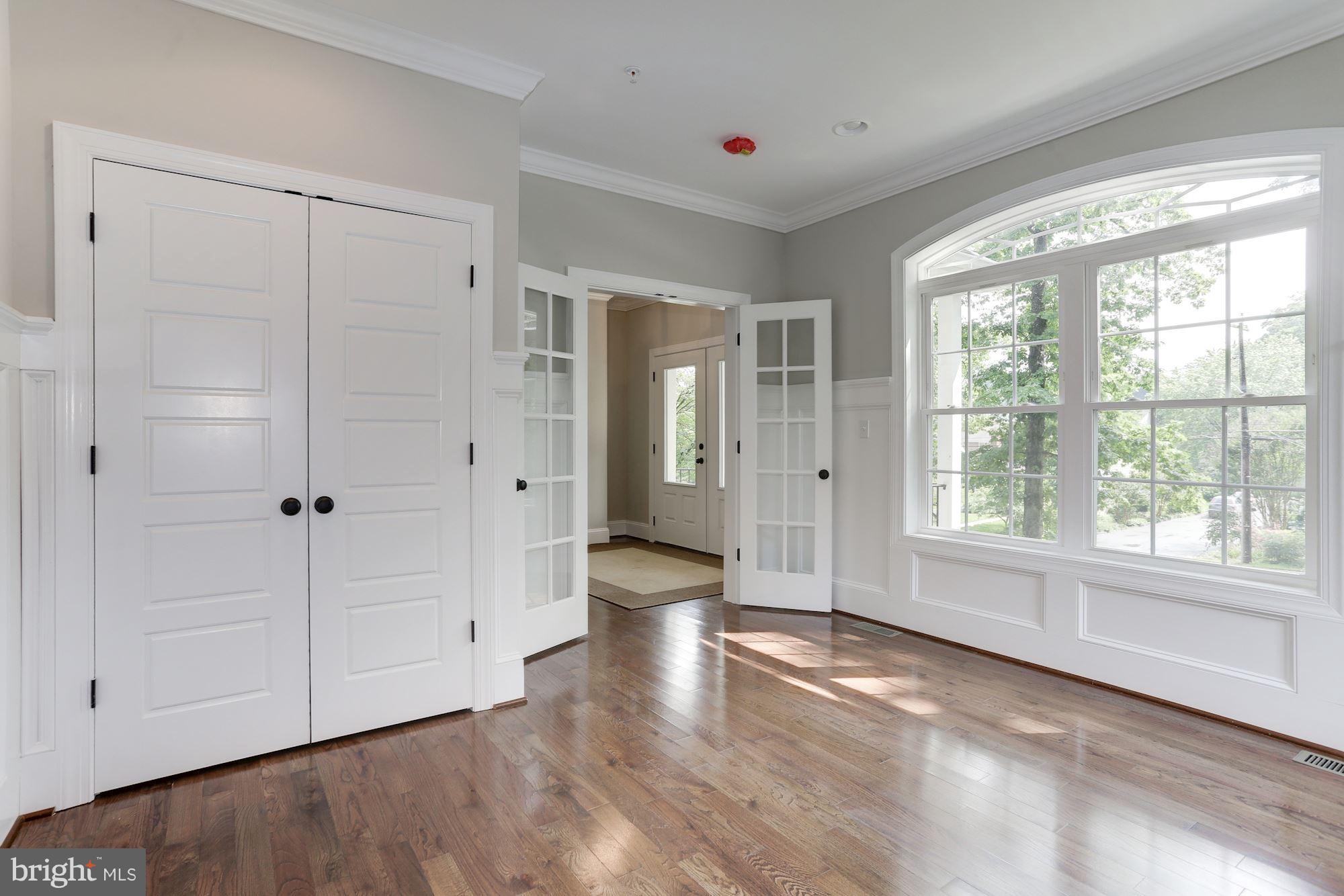 507 South Rolling Road Baltimore, MD 21228 - Photo 4 of 30 a view of an empty room with wooden floor and a window