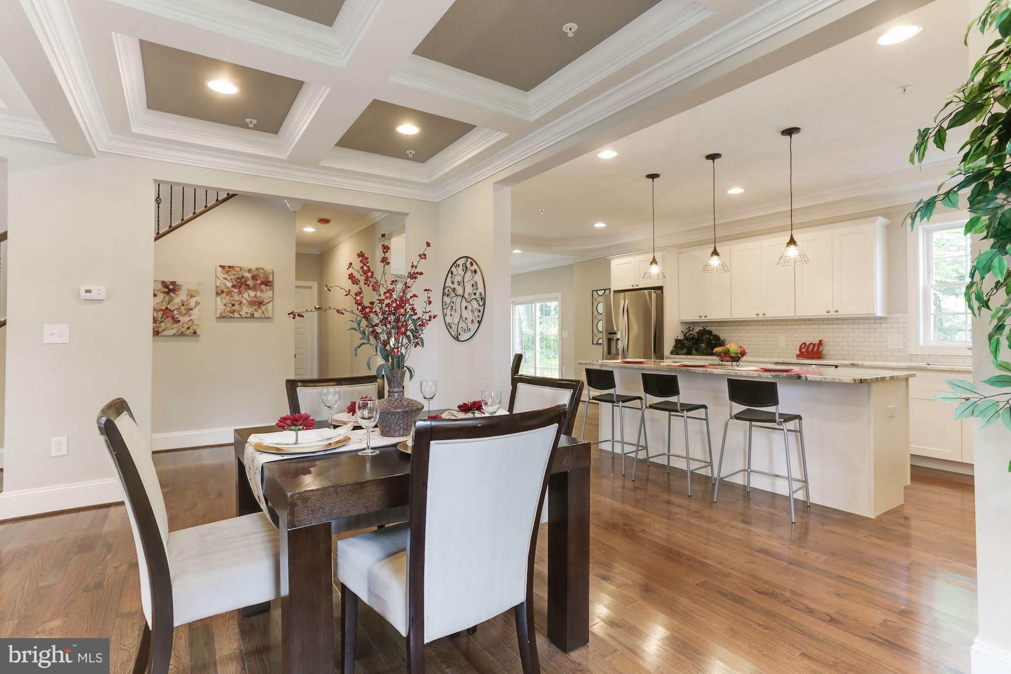507 South Rolling Road Baltimore, MD 21228 - Photo 9 of 30 a view of a dining room with furniture and wooden floor