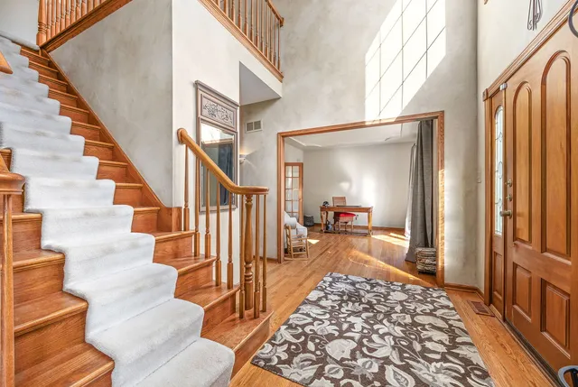 a view of a hallway view with staircase