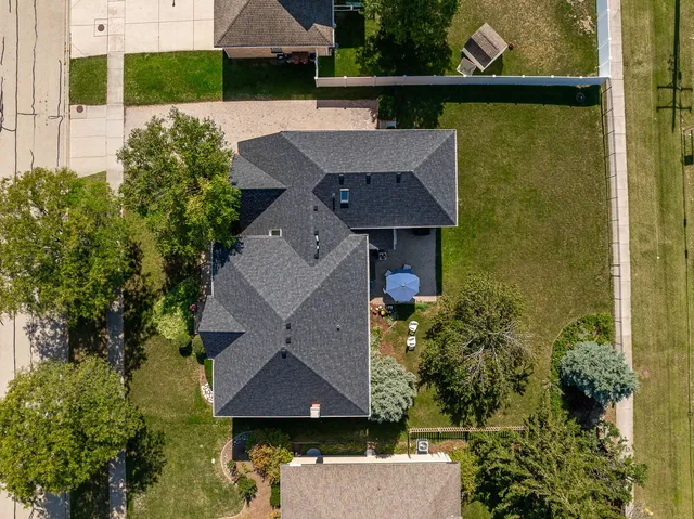 an aerial view of a house with swimming pool
