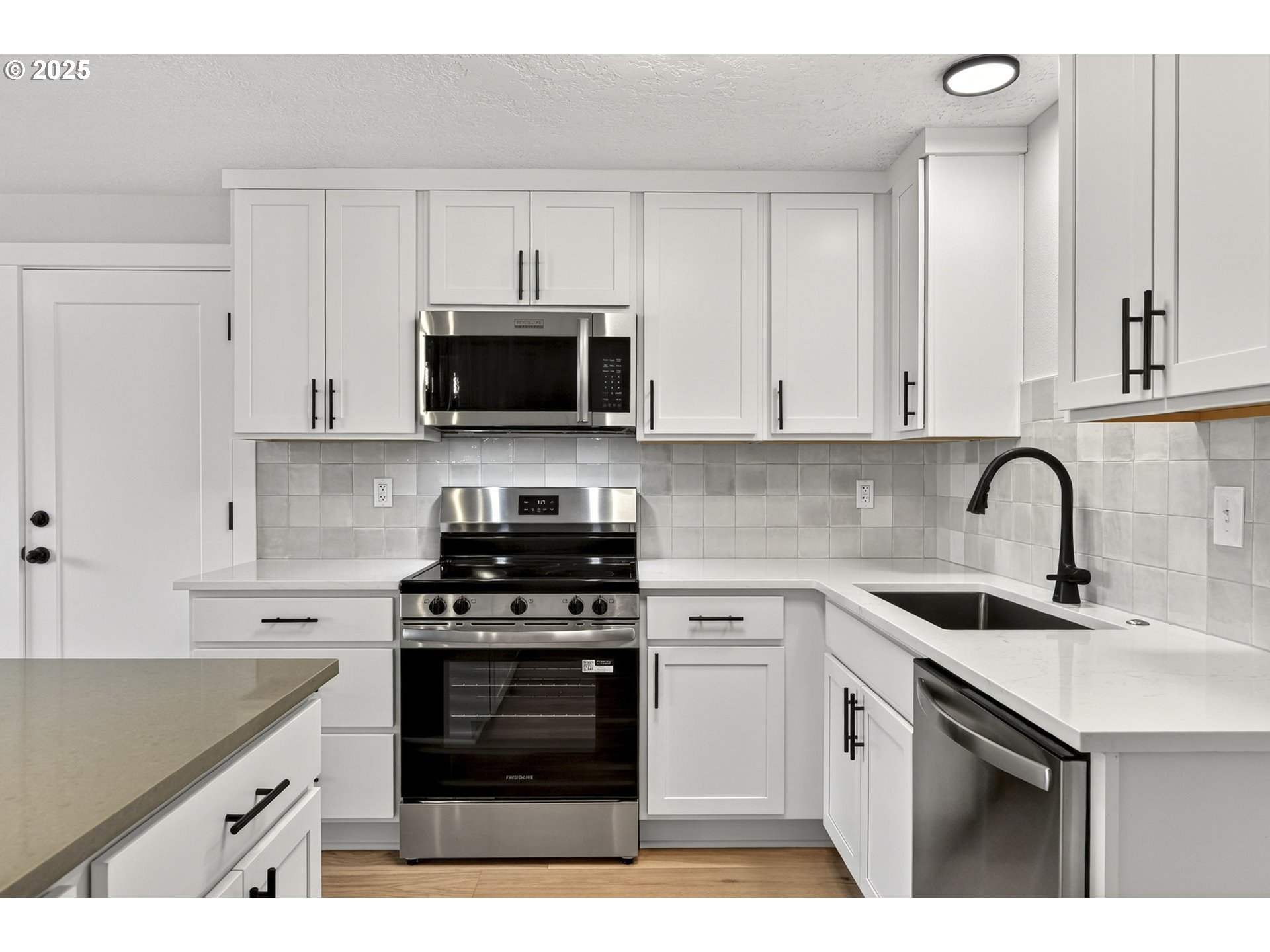 17745 Davis Drive Sandy, OR 97055 - Photo 13 of 44 a kitchen with cabinets stainless steel appliances a sink and a counter space