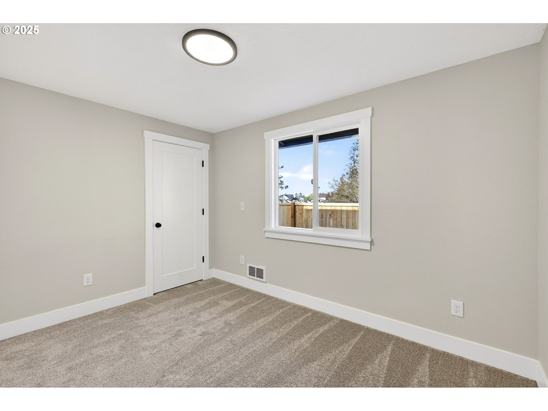 17745 Davis Drive Sandy, OR 97055 - Photo 25 of 44 a view of an empty room with window and wooden floor