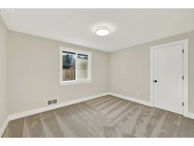 a view of an empty room with window