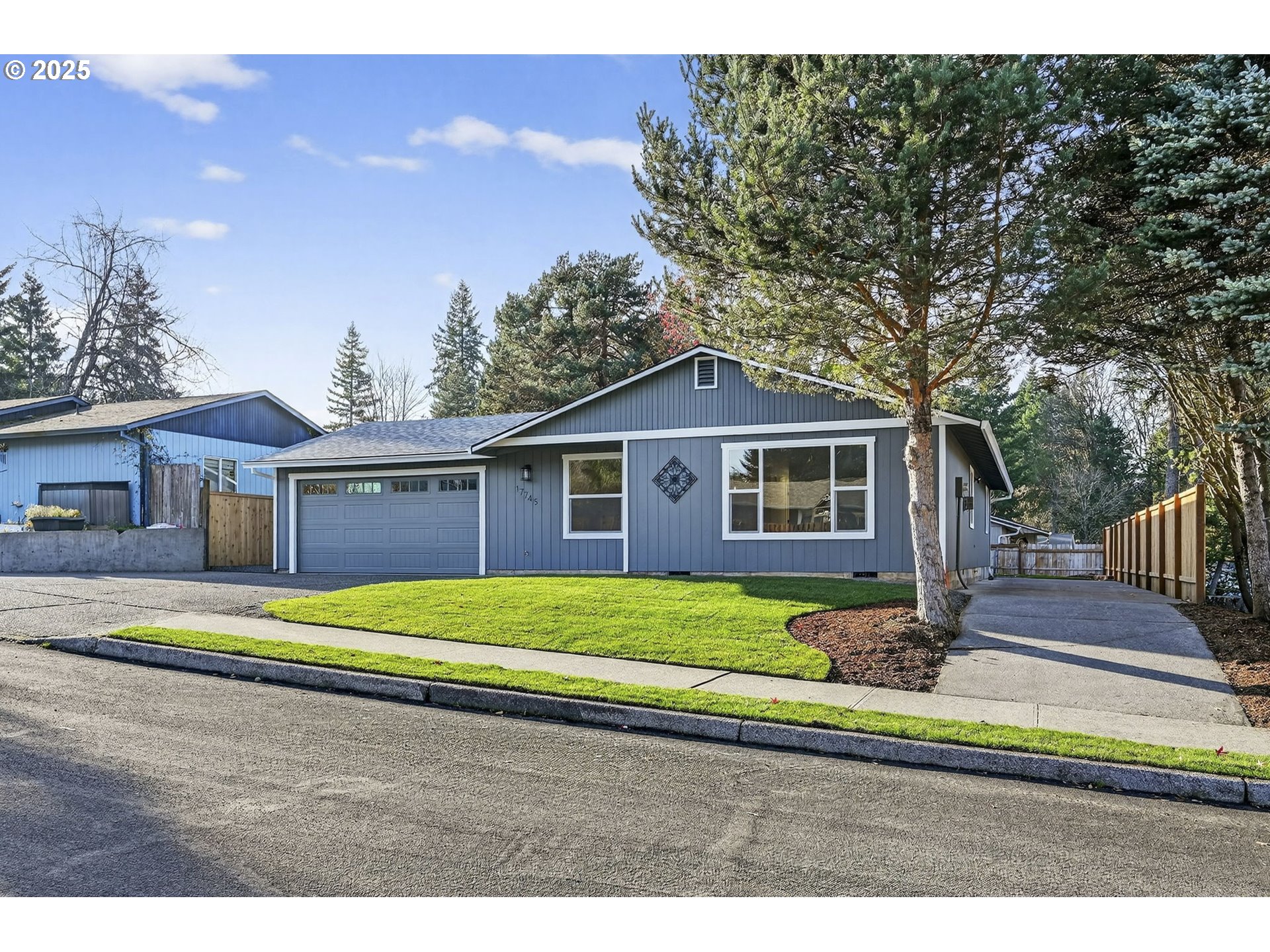 17745 Davis Drive Sandy, OR 97055 - Photo 3 of 44 a front view of a house with a yard