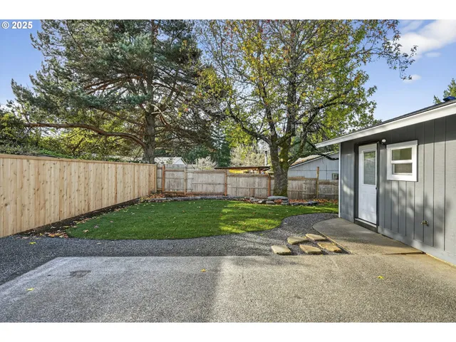 a backyard of a house with lots of green space