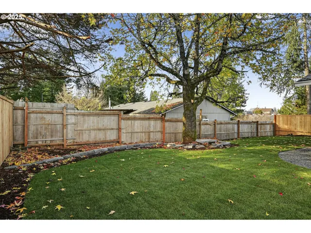a backyard of a house with lots of green space