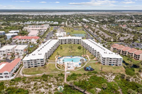 an aerial view of residential houses with outdoor space