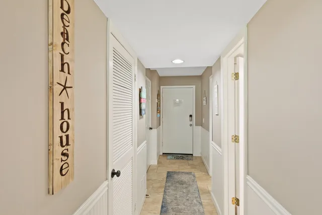 a large bed sitting in a bedroom next to a window