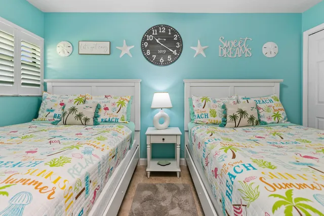 a view of a house with backyard porch and sitting area