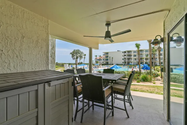 a view of a swimming pool with a yard