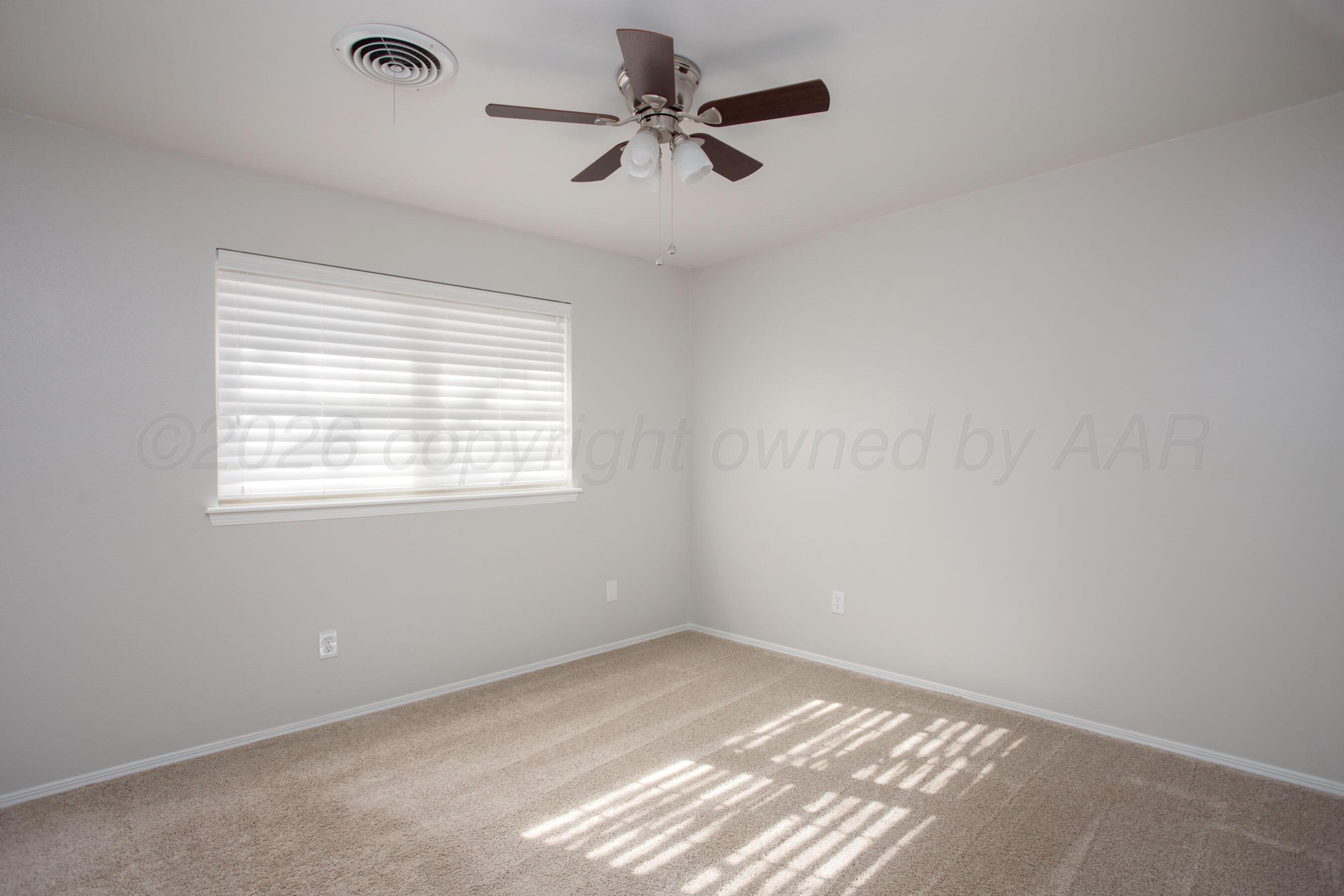 7924 Simpson Drive Amarillo, TX 79121 - Photo 18 of 33 a view of an empty room with a window