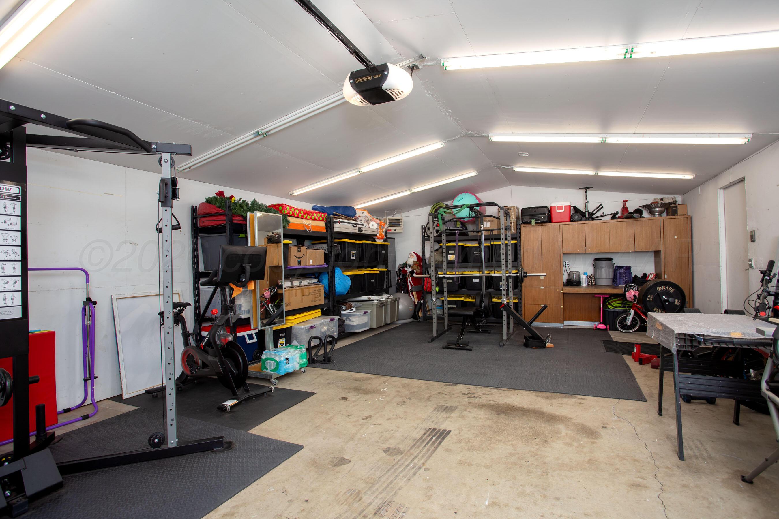 7924 Simpson Drive Amarillo, TX 79121 - Photo 27 of 33 a view of a garage with a lot of stuff