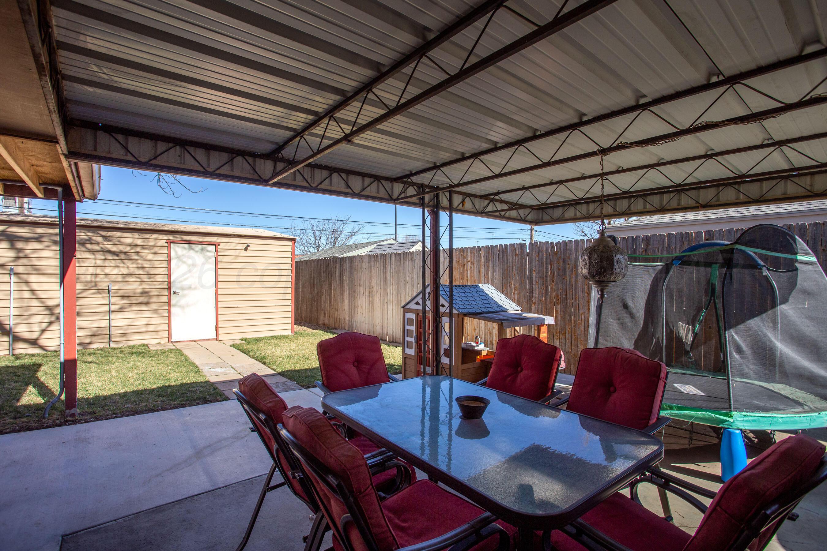 7924 Simpson Drive Amarillo, TX 79121 - Photo 29 of 33 a outdoor dining space with furniture and rug