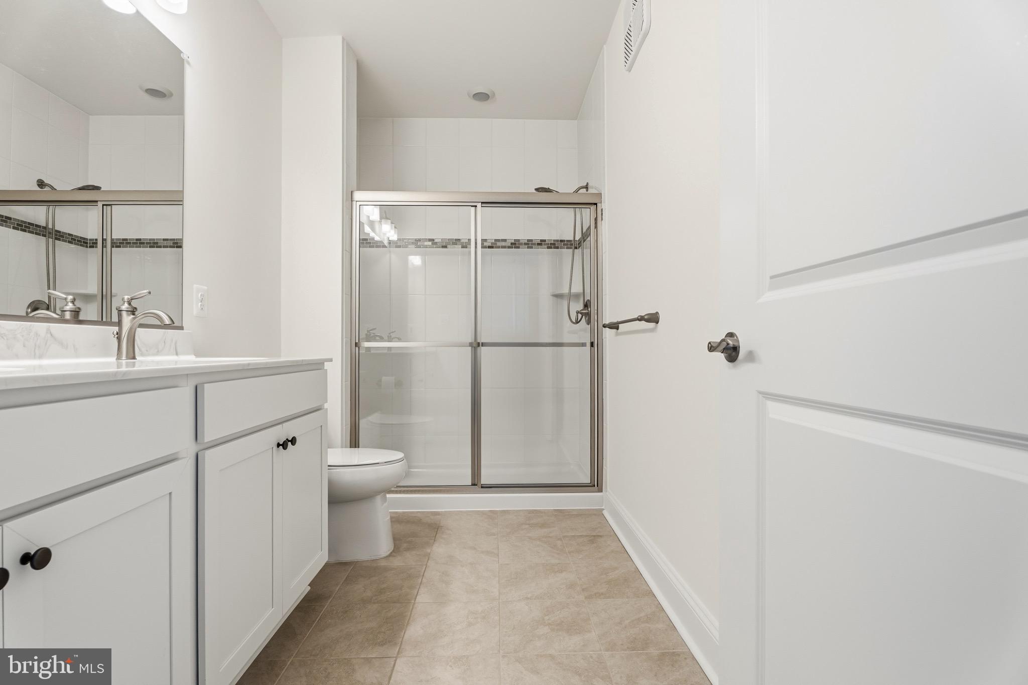 406 Bold Ruler Court, Unit 402 Havre de Grace, MD 21078 - Photo 11 of 49 a bathroom with a granite countertop sink toilet and shower
