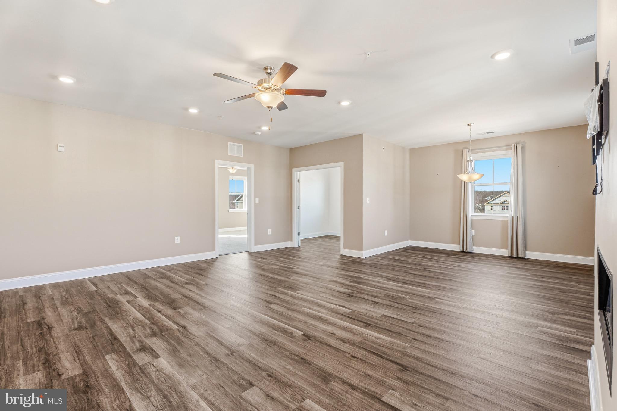 406 Bold Ruler Court, Unit 402 Havre de Grace, MD 21078 - Photo 19 of 49 a view of an empty room with window and wooden floor