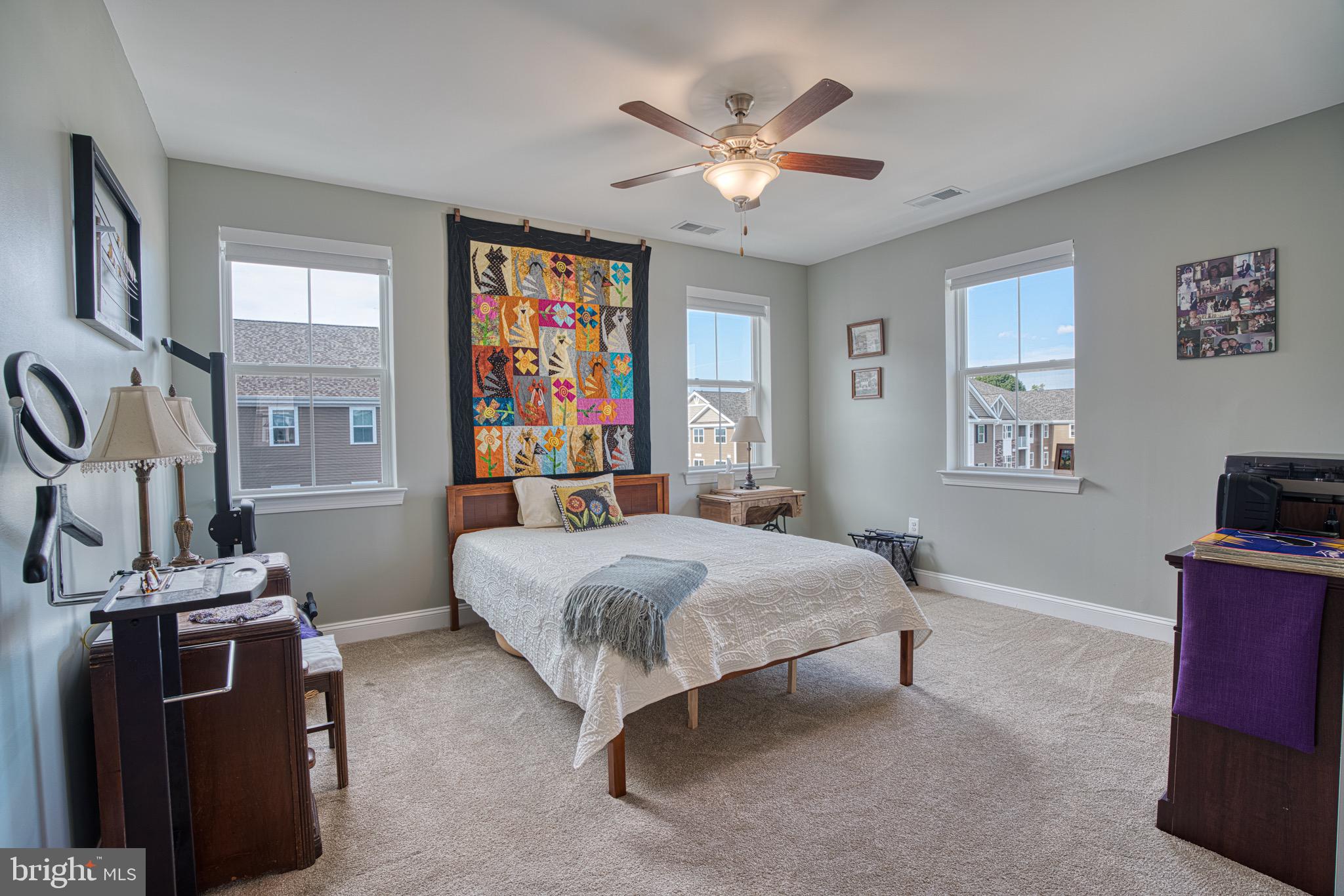 406 Bold Ruler Court, Unit 402 Havre de Grace, MD 21078 - Photo 19 of 43 Bright and airy bedroom with vibrant decor.