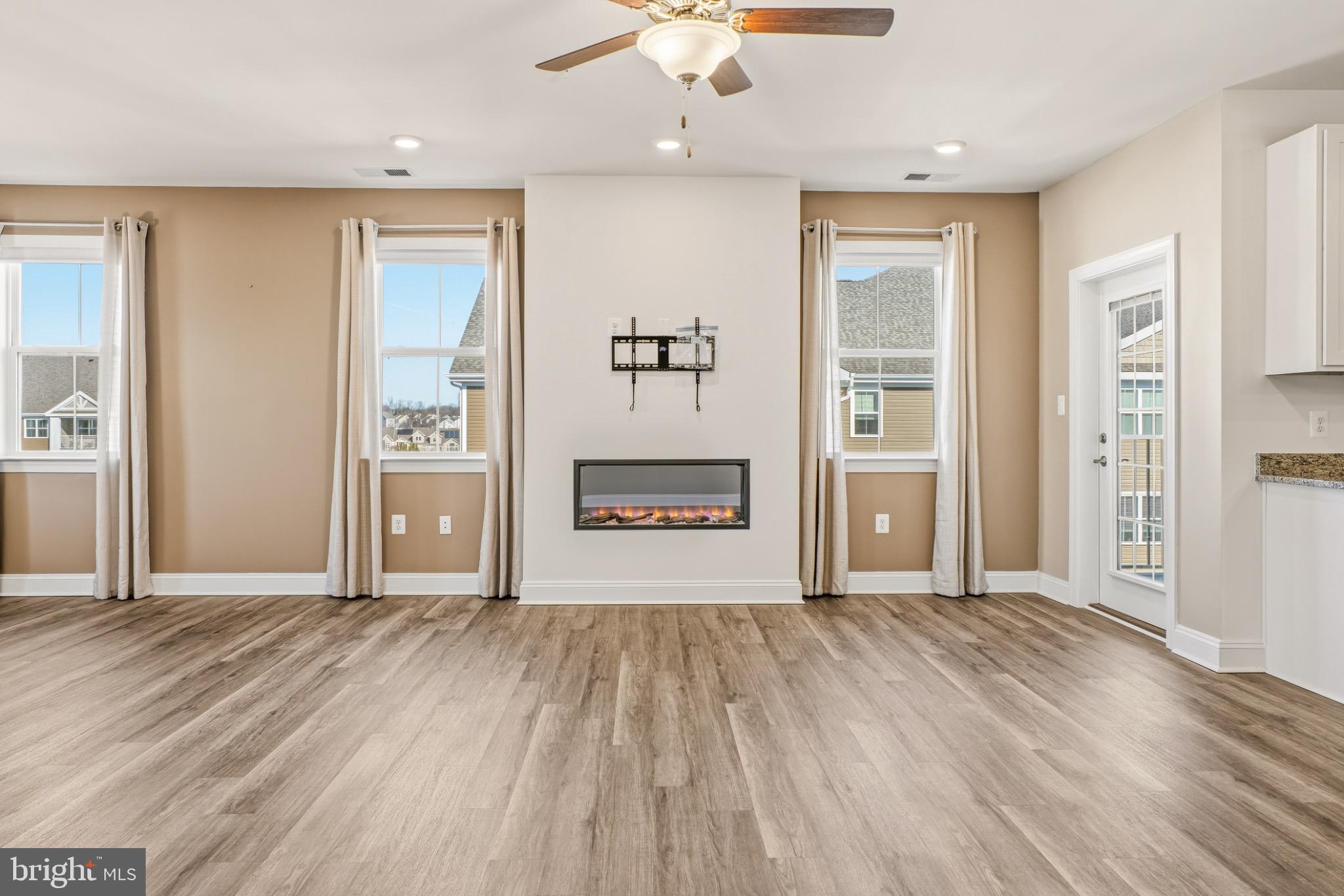 406 Bold Ruler Court, Unit 402 Havre de Grace, MD 21078 - Photo 20 of 49 wooden floor in an empty room with a window