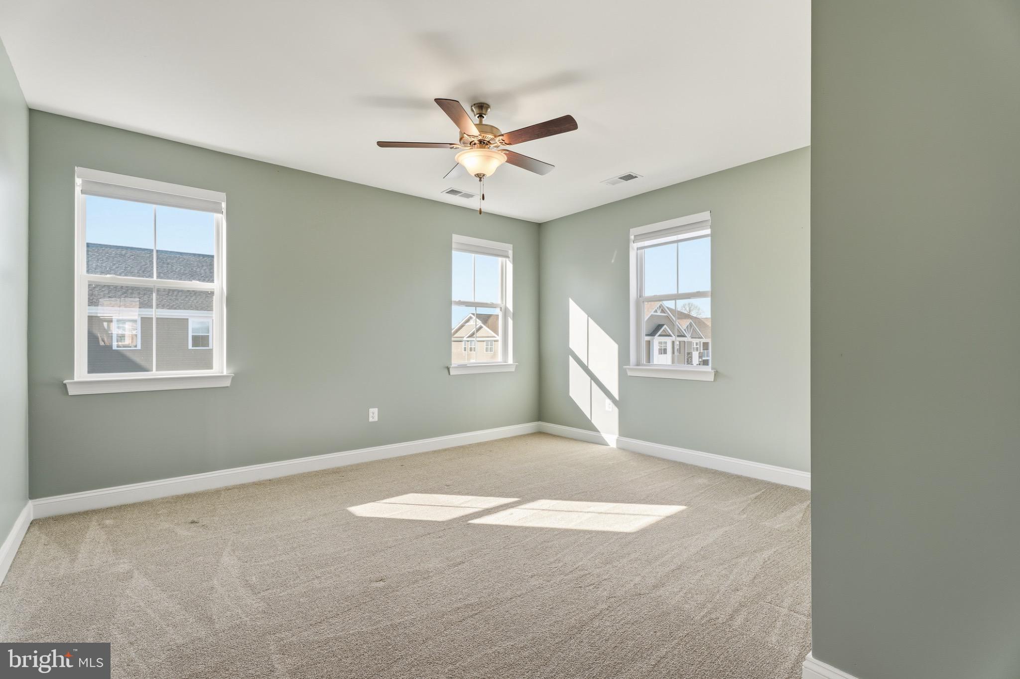 406 Bold Ruler Court, Unit 402 Havre de Grace, MD 21078 - Photo 24 of 49 an empty room with windows and fan