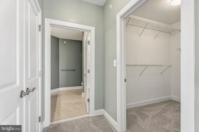 a view of a bathroom from a hallway