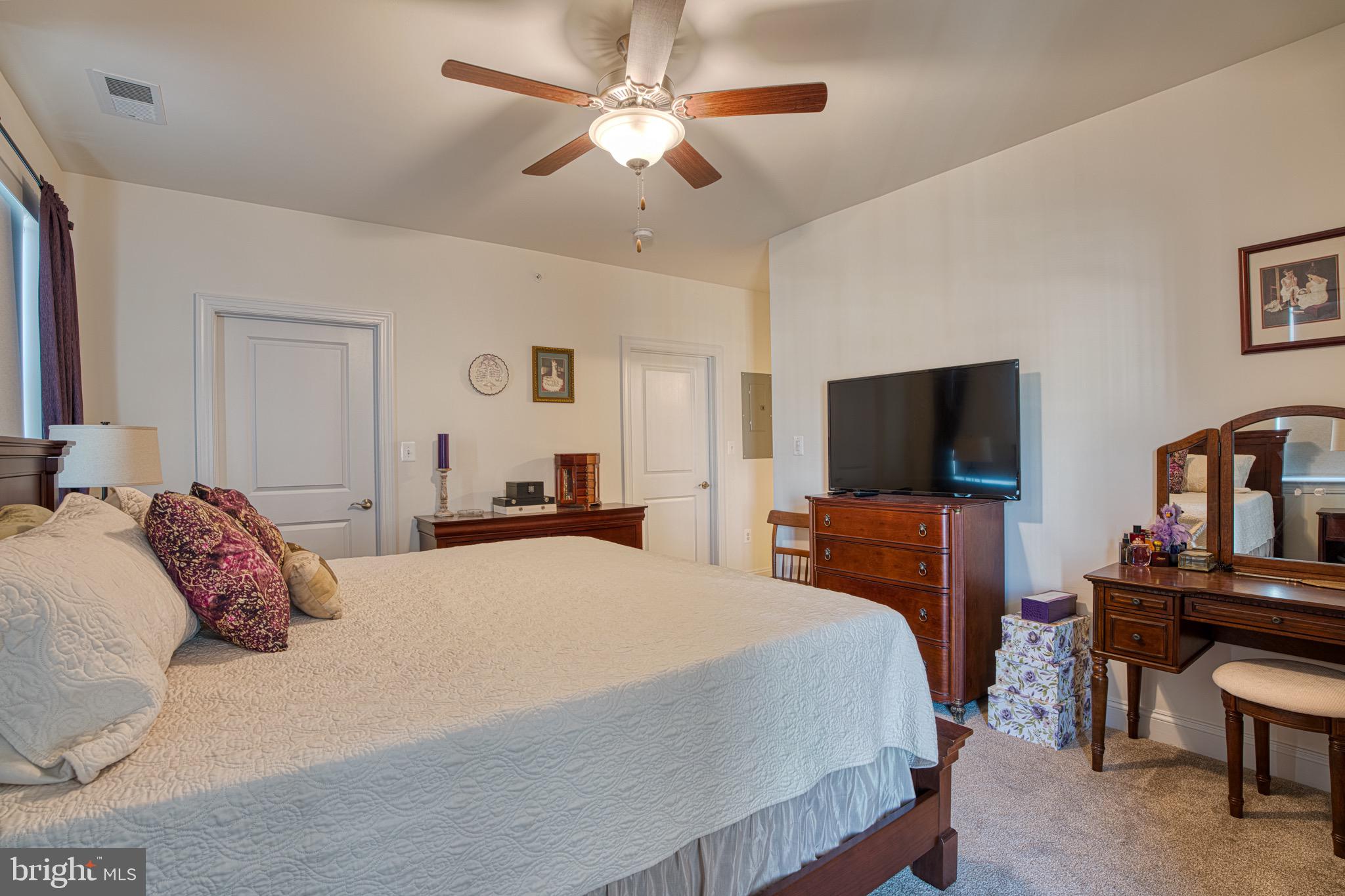 406 Bold Ruler Court, Unit 402 Havre de Grace, MD 21078 - Photo 28 of 43 Cozy bedroom with warm, inviting ambiance.