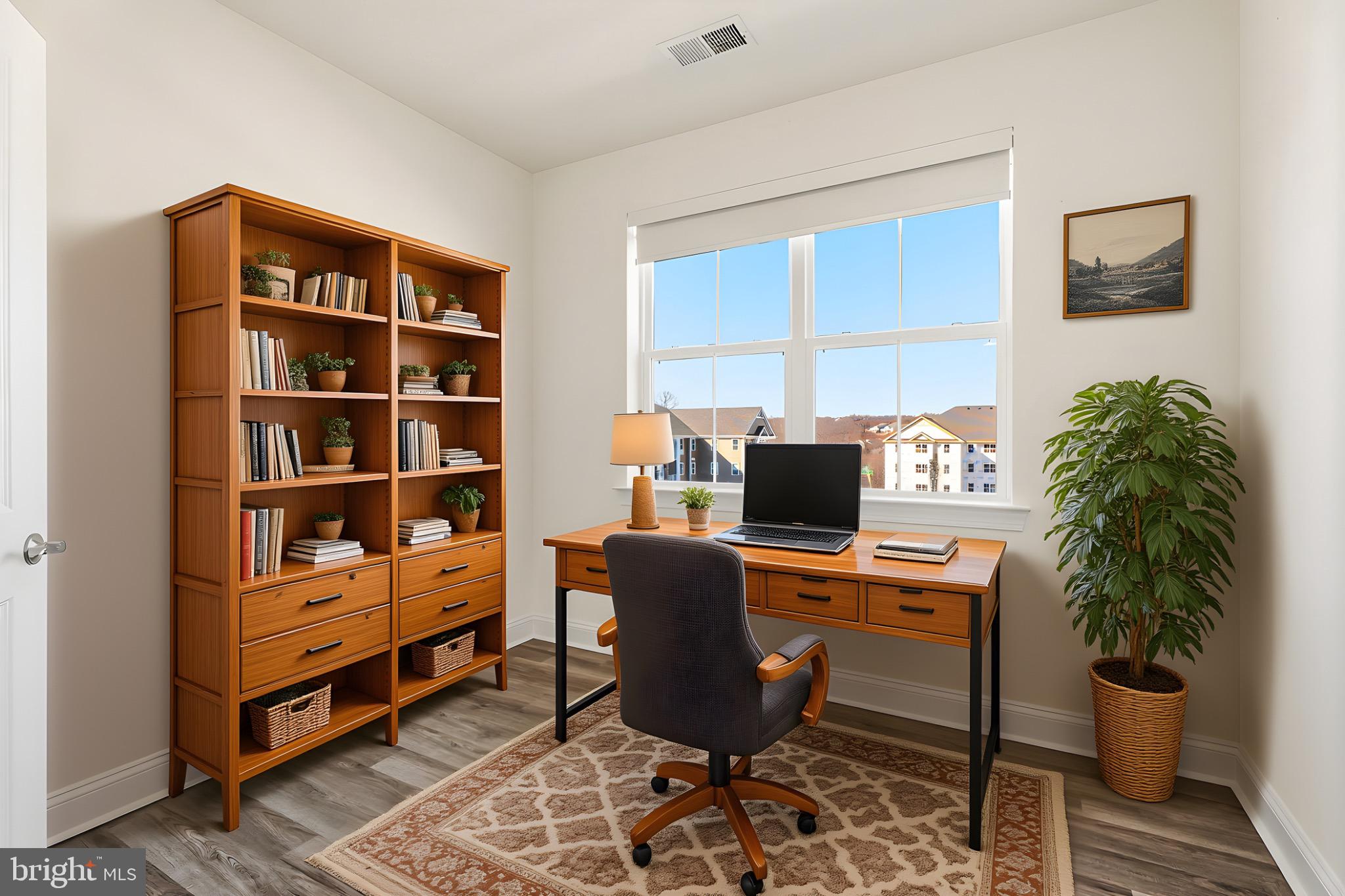 406 Bold Ruler Court, Unit 402 Havre de Grace, MD 21078 - Photo 4 of 49 a workspace with furniture and a potted plant