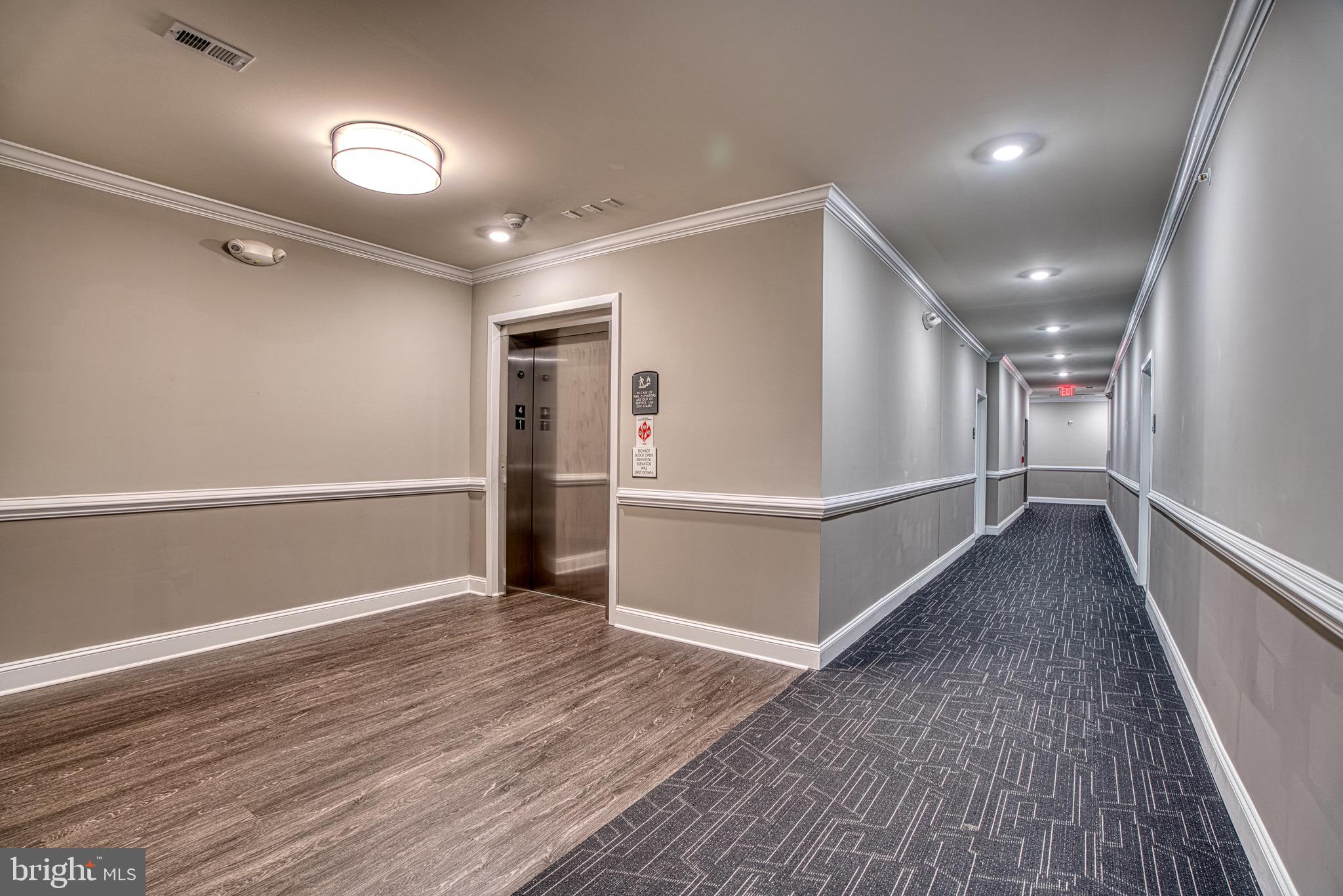 406 Bold Ruler Court, Unit 402 Havre de Grace, MD 21078 - Photo 5 of 43 Modern corridor with sleek elevator access.