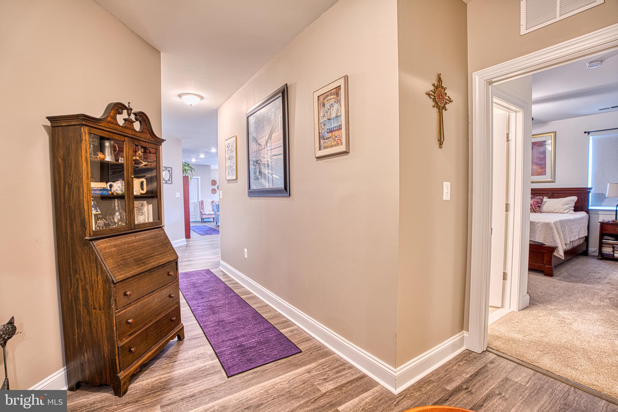 406 Bold Ruler Court, Unit 402 Havre de Grace, MD 21078 - Photo 6 of 43 Inviting hallway with charming decor.