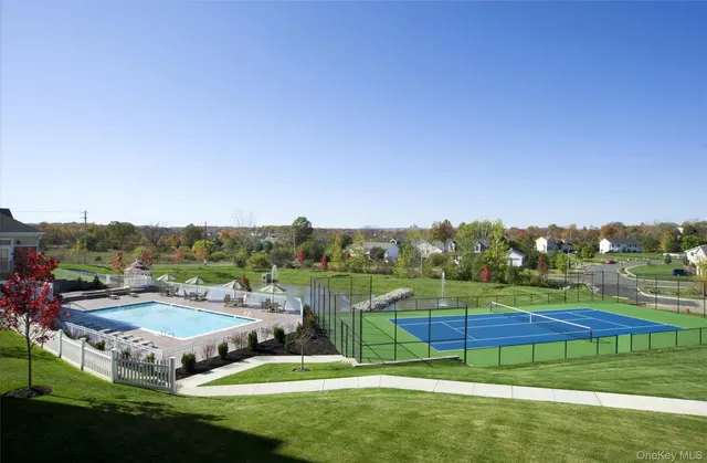 swimming pool view with a outdoor seating