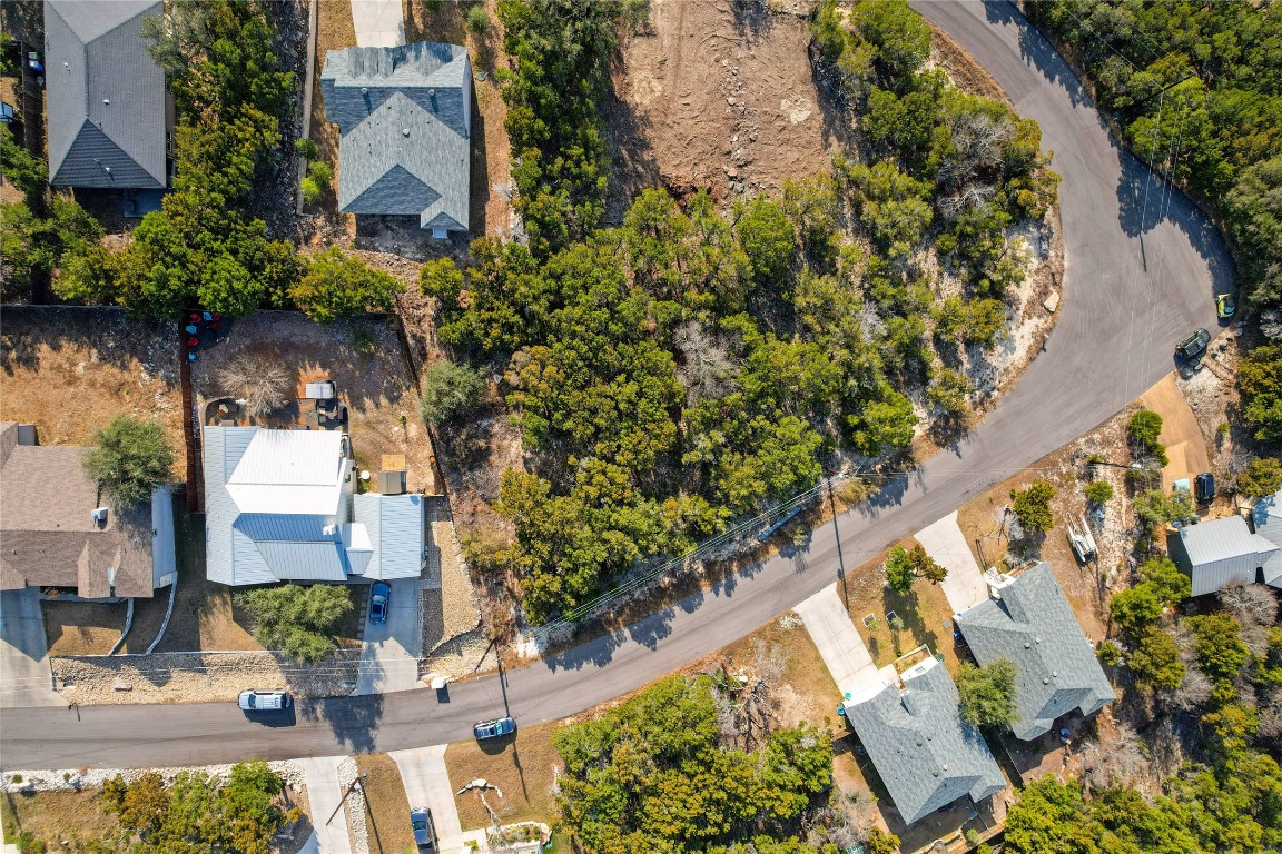 8010 Flintlock Circle Lago Vista, TX 78645 - Photo 13 of 15 an aerial view of a house with a yard and blue swimming pool