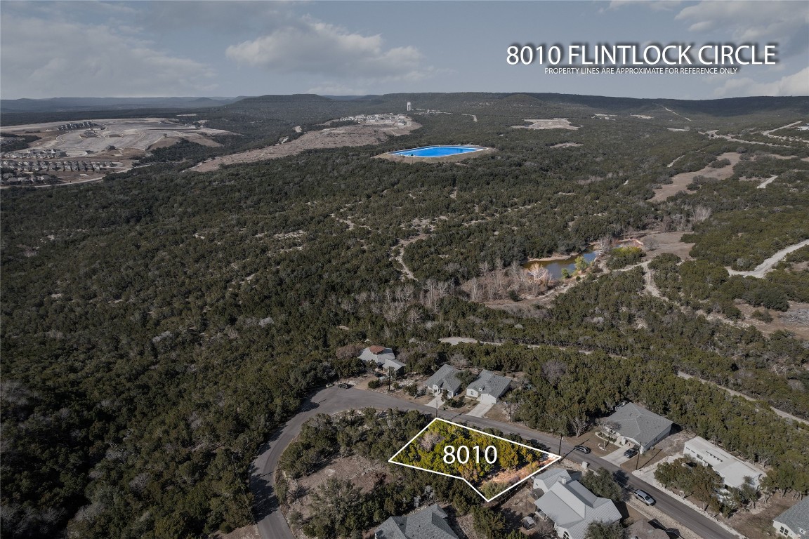 8010 Flintlock Circle Lago Vista, TX 78645 - Photo 2 of 15 a view of a street with parking space