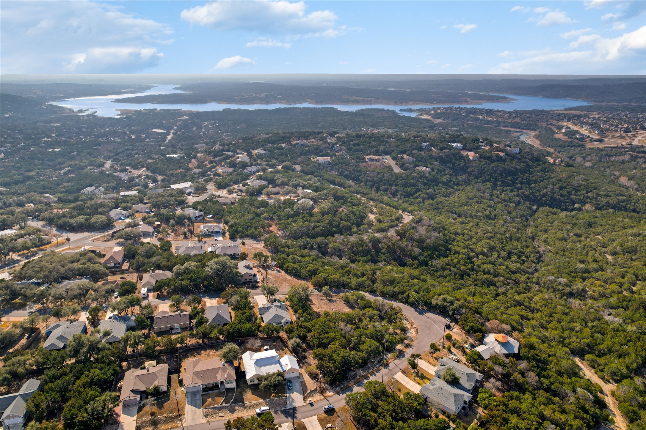 8010 Flintlock Circle Lago Vista, TX 78645 - Photo 5 of 15 an aerial view of residential building with green space