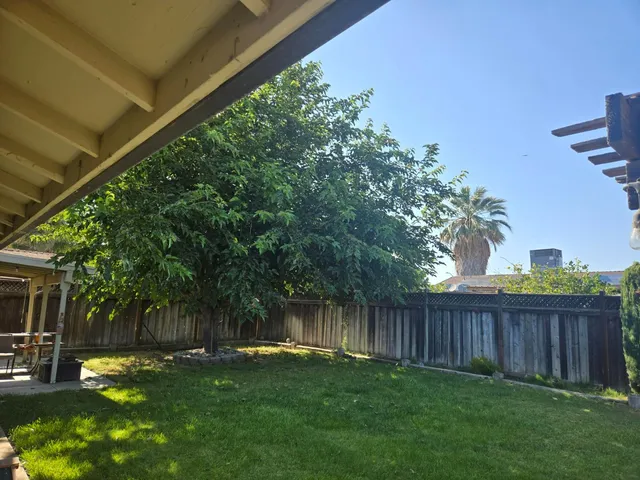 a backyard of a house with lots of green space