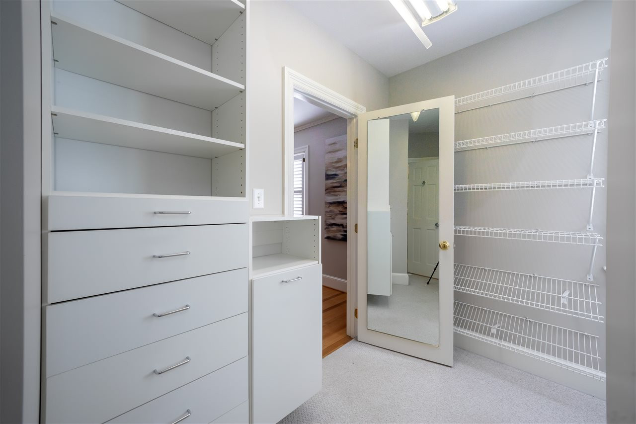 1110 Harvey Street Raleigh, NC 27608 - Photo 15 of 30 Large dual-area walk-in closet off of the master bedroom. Walk-in Closet