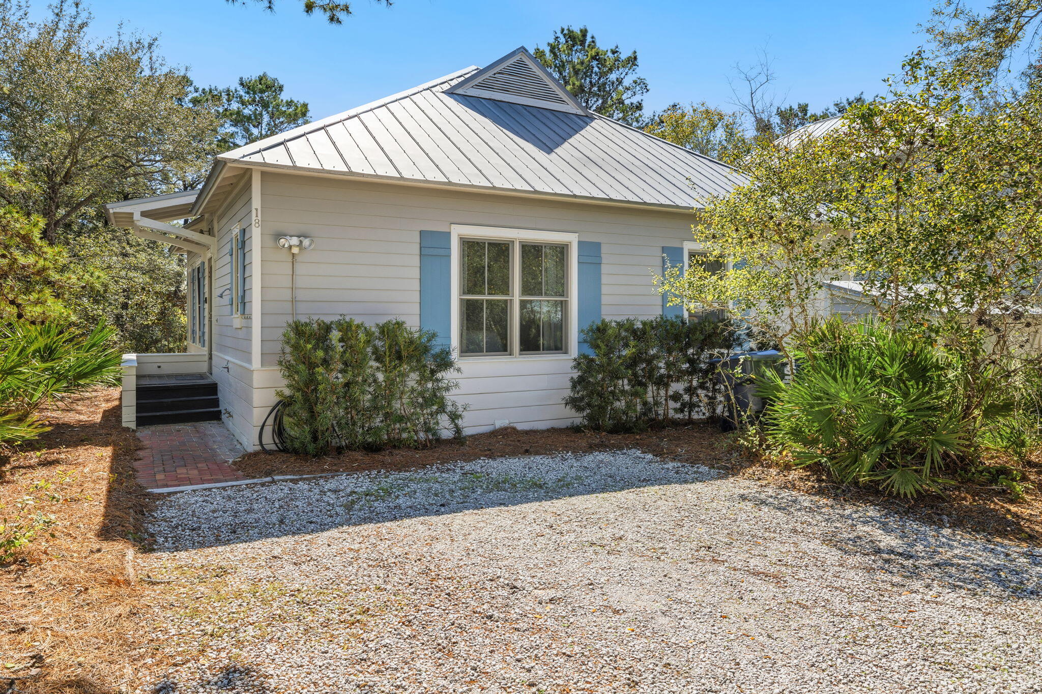 18 Kareny Lane Inlet Beach, FL 32461 - Photo 2 of 48 a front view of a house with garden