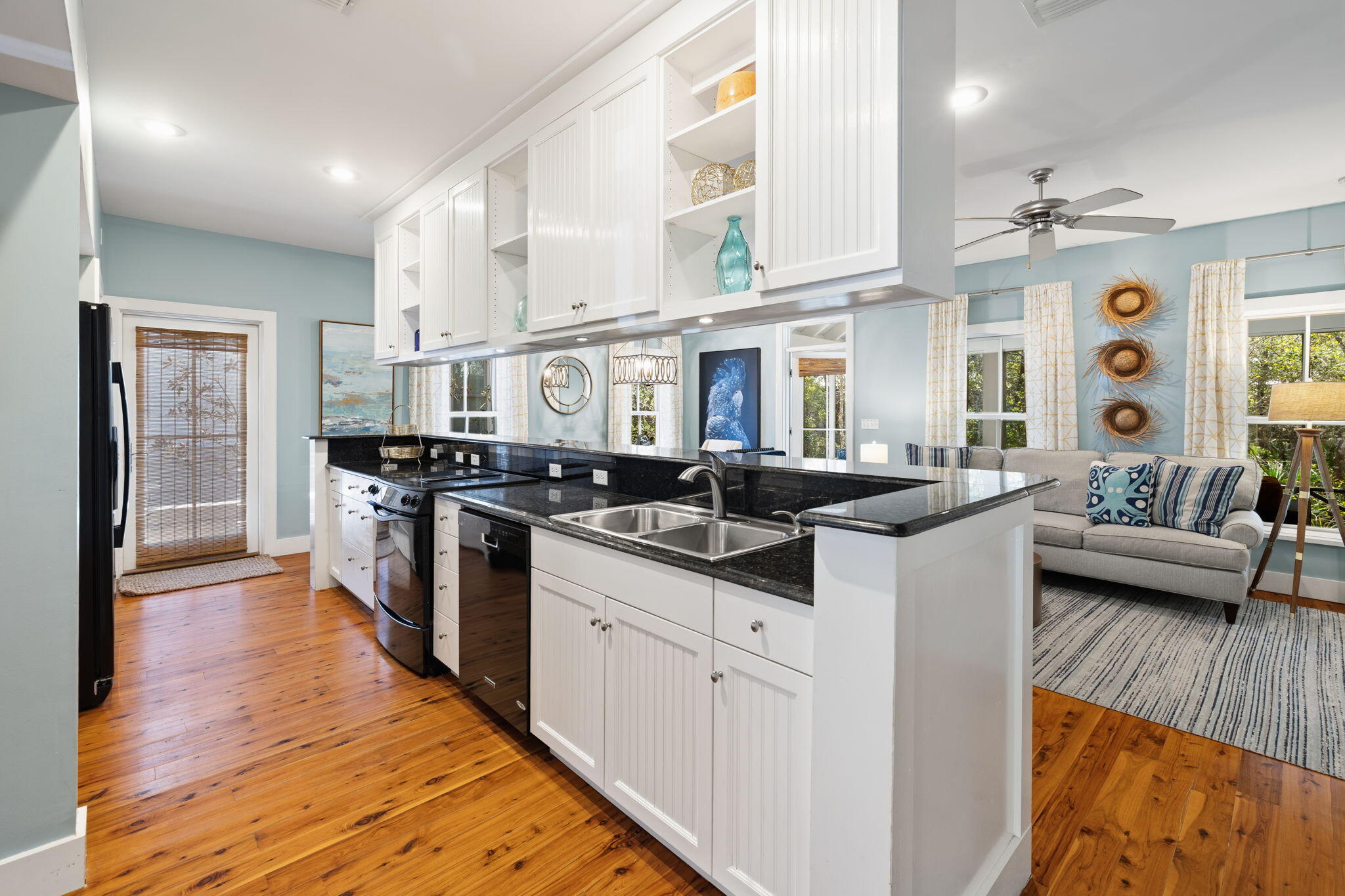 18 Kareny Lane Inlet Beach, FL 32461 - Photo 28 of 48 a kitchen with stainless steel appliances kitchen island granite countertop a sink cabinets and wooden floor
