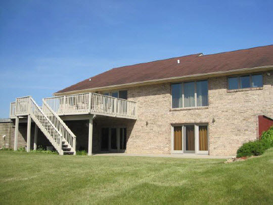 6966 North Marrill Road Byron, IL 61010 - Photo 2 of 11 a front view of a house with a yard