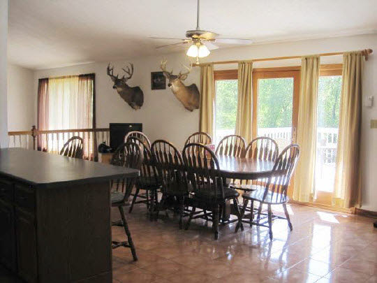 6966 North Marrill Road Byron, IL 61010 - Photo 6 of 11 a view of a a dining room with furniture window and wooden floor