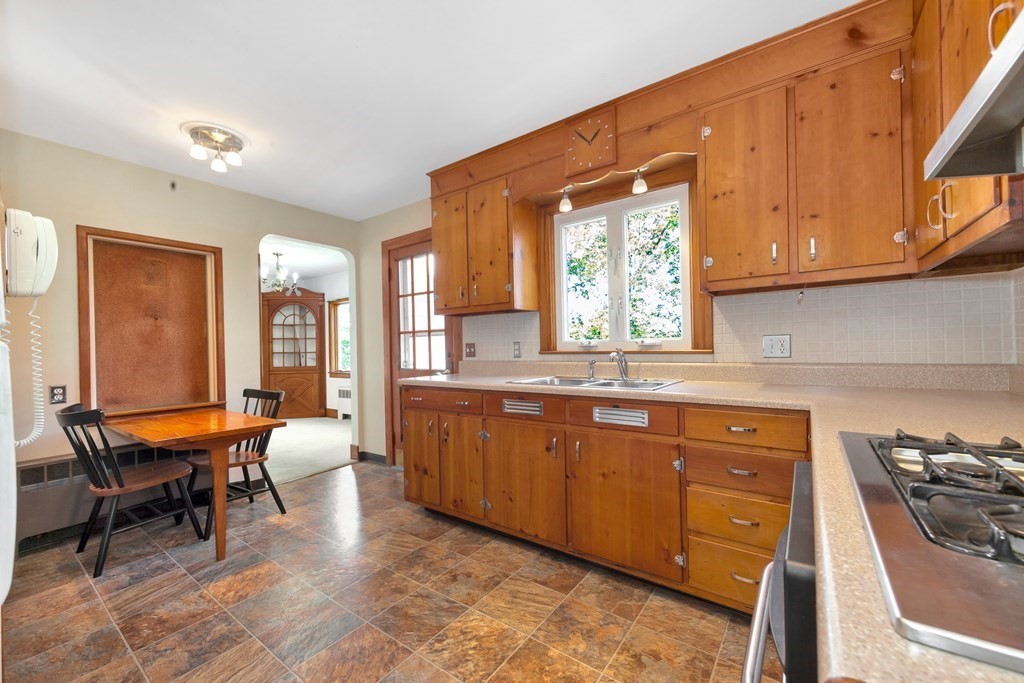 8 Tower Road Lexington, MA 02421 - Photo 12 of 39 a large kitchen with stainless steel appliances granite countertop a sink and cabinets