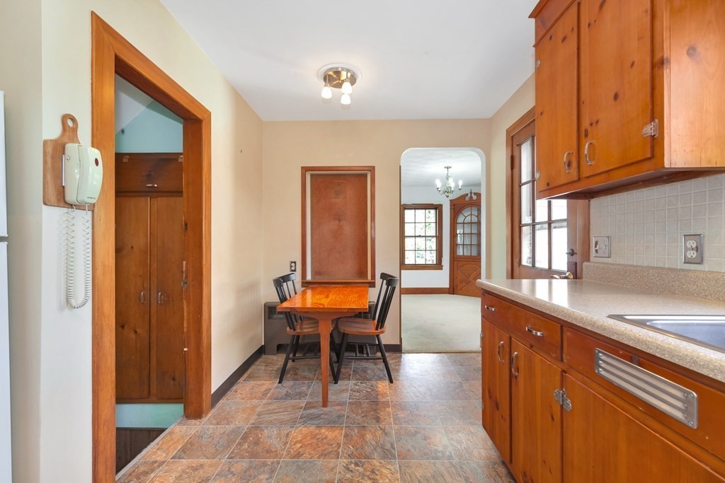 8 Tower Road Lexington, MA 02421 - Photo 13 of 39 a large room with glass door and furniture