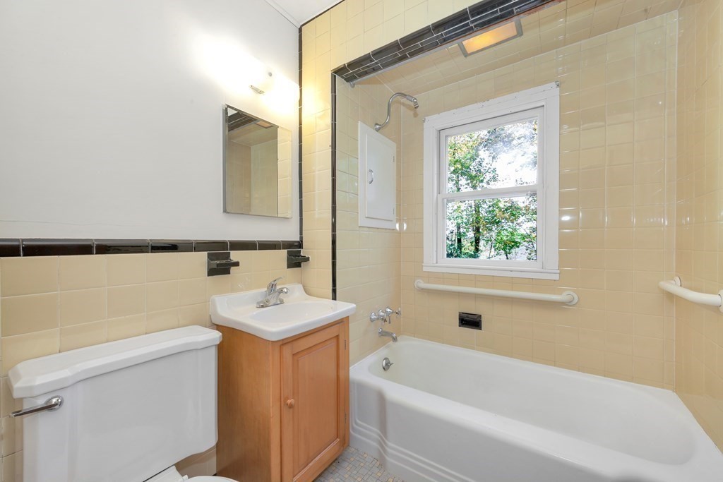 8 Tower Road Lexington, MA 02421 - Photo 21 of 39 a bathroom with a sink a toilet and shower