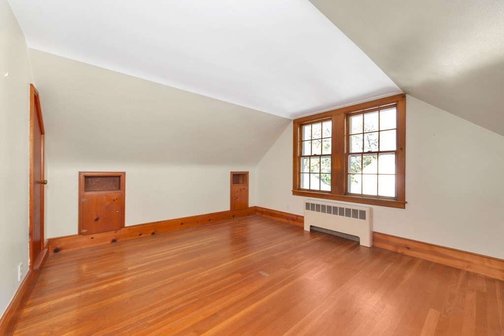 8 Tower Road Lexington, MA 02421 - Photo 25 of 39 an empty room with wooden floor and windows