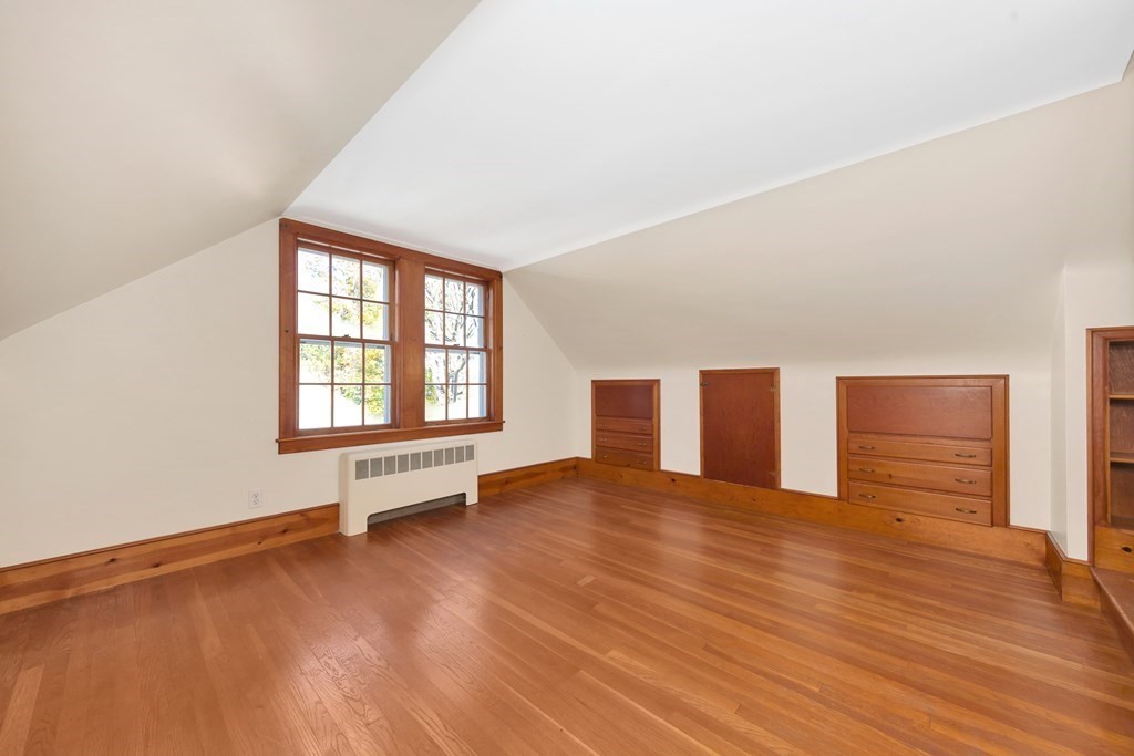8 Tower Road Lexington, MA 02421 - Photo 26 of 39 a view of an empty room with wooden floor and a window