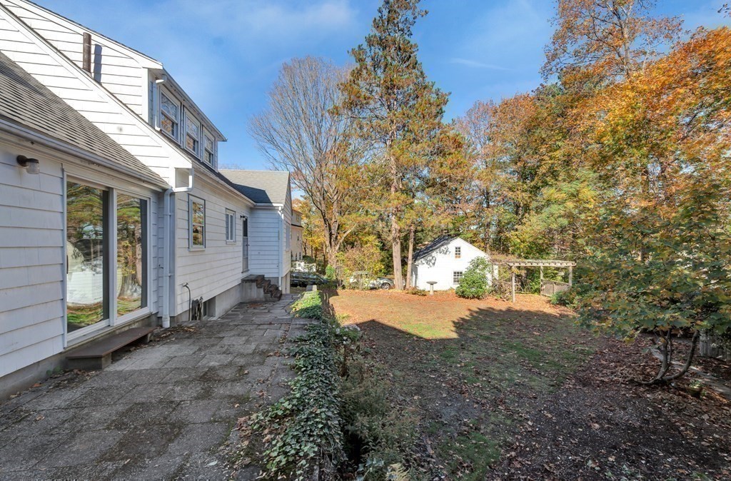 8 Tower Road Lexington, MA 02421 - Photo 33 of 39 a view of a house with a snow in the yard