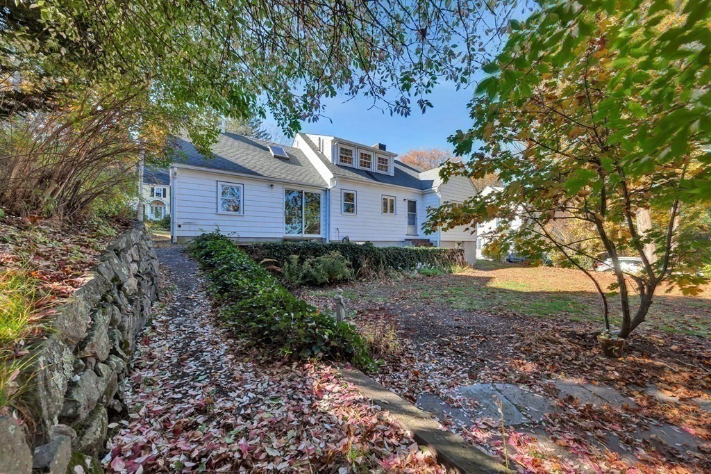 8 Tower Road Lexington, MA 02421 - Photo 38 of 39 a house is sitting in middle of the forest