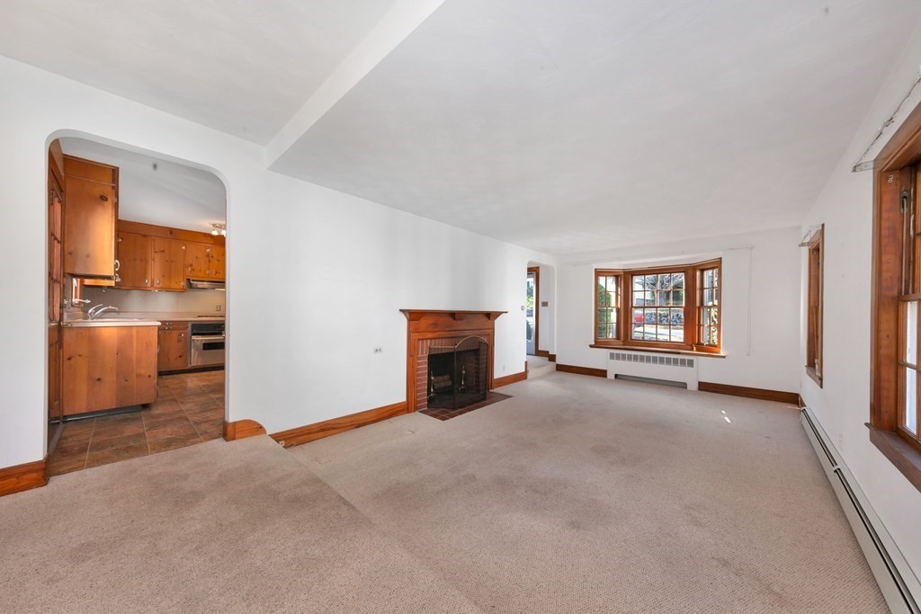 8 Tower Road Lexington, MA 02421 - Photo 8 of 39 a view of a livingroom with a fireplace