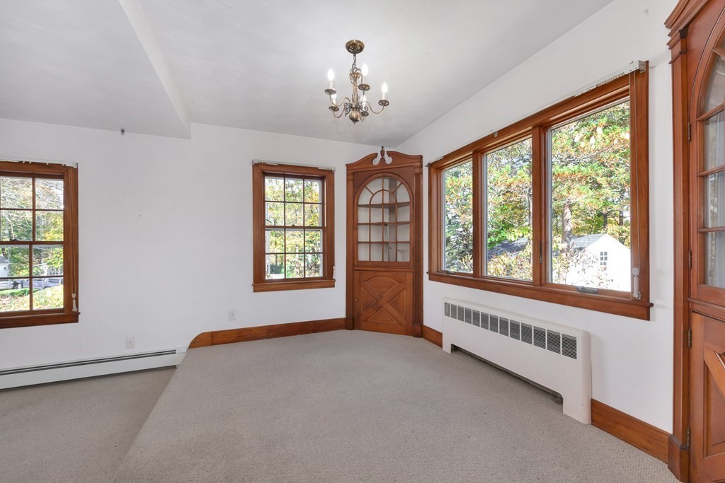8 Tower Road Lexington, MA 02421 - Photo 9 of 39 a view of an empty room with a window